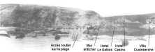 (details) Soldiers cross the destroyed anti-tank wall at the bottom of Vierville in an Indian line. Access to the road from the beach was built in front of the casemate