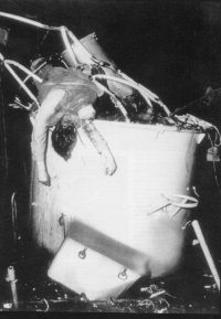 (details) A GMC truck in front of the wreckage of a LCVP. (details) A dead sailor on his boat. (details) Summary meals on the beach (details)