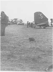 Behind the tail of DC3, we see a P47 fighter "Thunderbolt" who landed on the belly