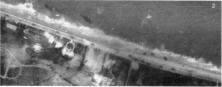 (détails) Sur cette photo, proche de D1, on distingue en tout 14 chars , mais aussi 2 LCA échoués dans les rouleaux, vestiges du débarquement des compagnies A et B/116. I