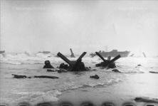 Other detail - GIs have just come out of the LCVP and are walking under fire in the middle of the other detail -GIs sheltering behind other metal hedgehogs