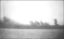 notice the vertical smoke trace of a secondary explosion