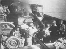The M7 "Priest" howitzers in action from their LCT (film extract) (details) LCT(R) in action In the 1st plane a "canard", at the bottom, the smoke of the shots of a LCT"Rocket"